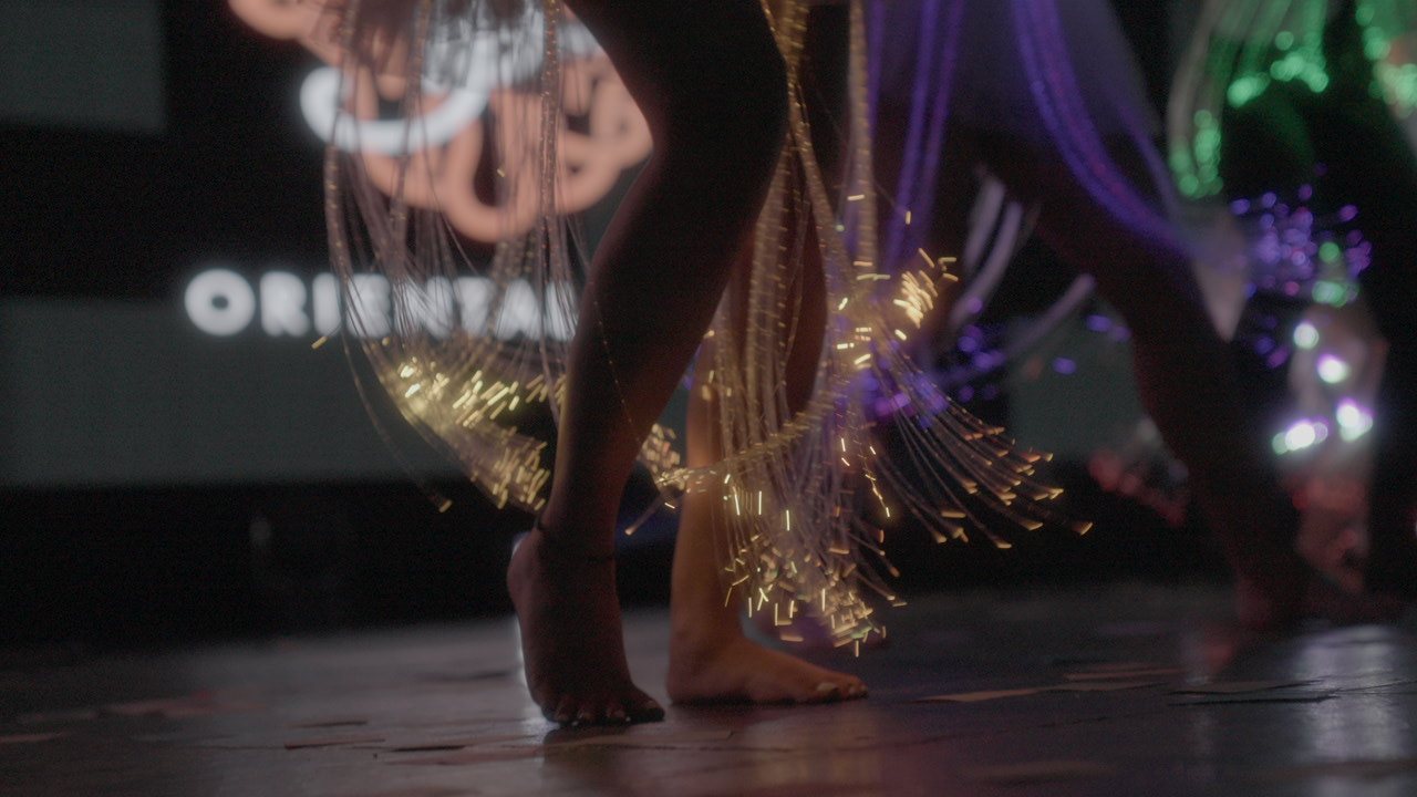 Dancer in flowing costume performing on stage